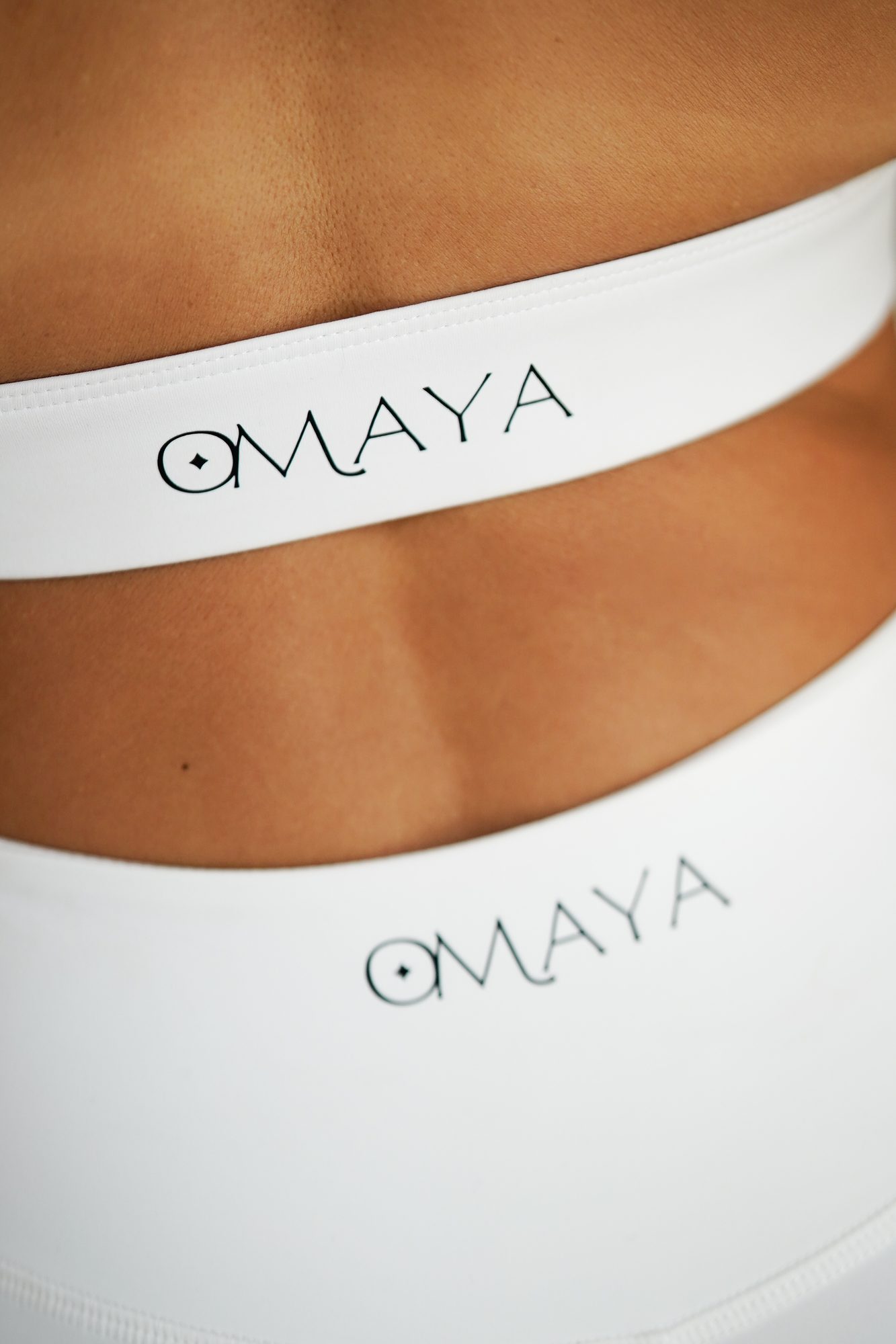 Omaya activewear brand logo detail