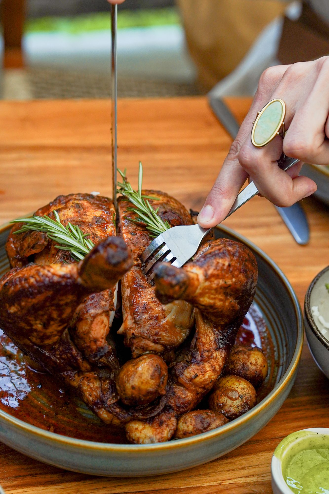 Rotisserie Bali chicken carving